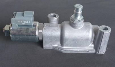 Caterpillar modulating valves control the control clutch oil pressure.